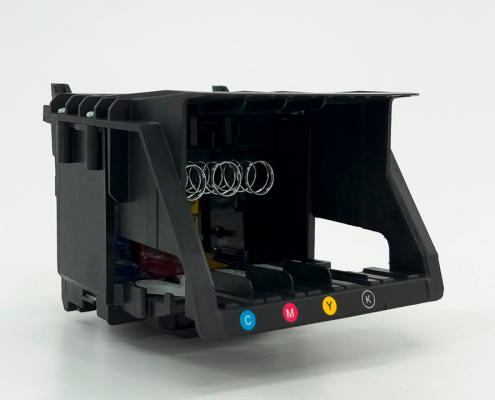 Austauschbarer Druckkopf für Komdruck Tintenstrahldrucker auf hellgrauem Hintergrund